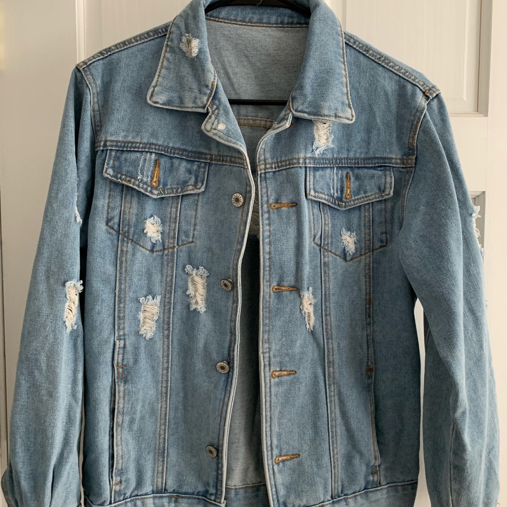 Ripped jean jacket light wash